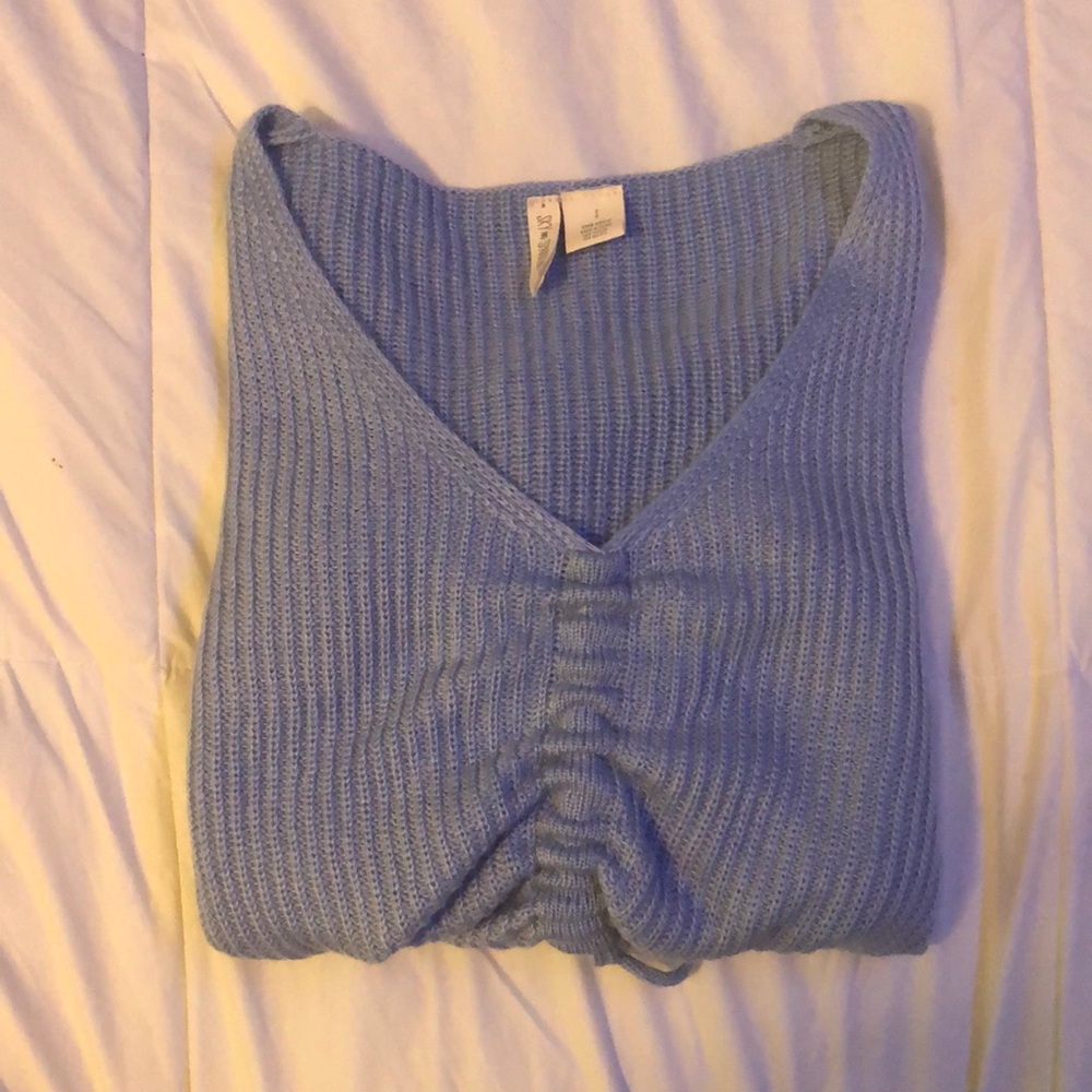 Baby blue cinched knit sweater.
